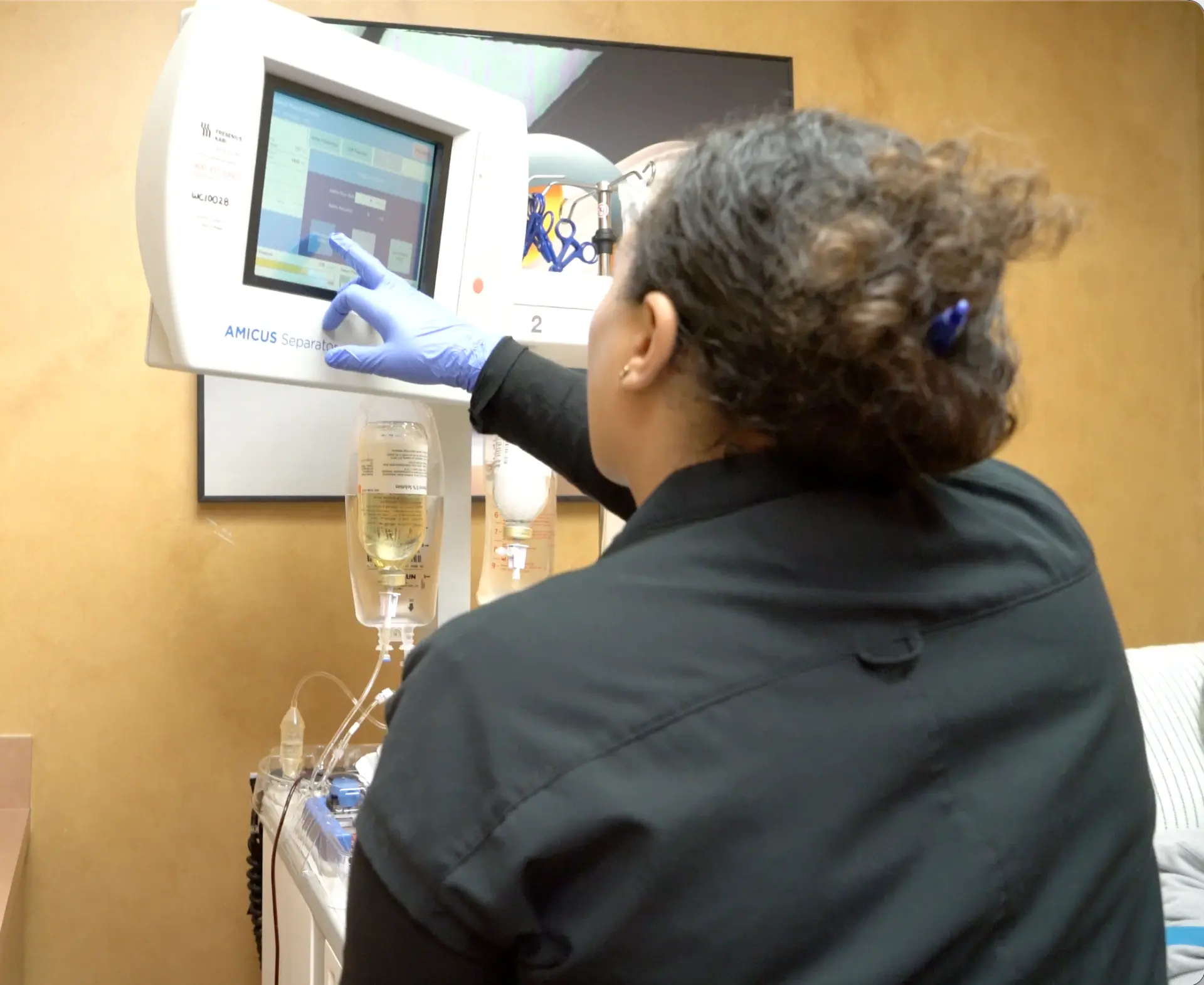 Clinician operating the Amicus Separator during a therapeutic plasma exchange session